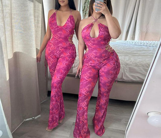 Dame luftig jumpsuit med dyb V-udskæring og legende bindebånd Stilla