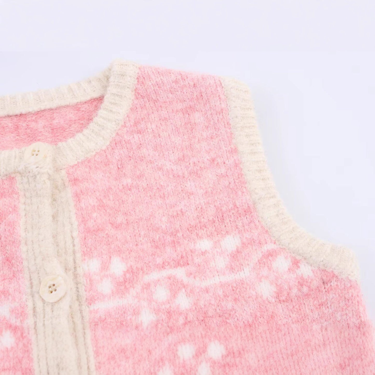 Dame strikvest med blomsterdesign og knaplukning Stilla