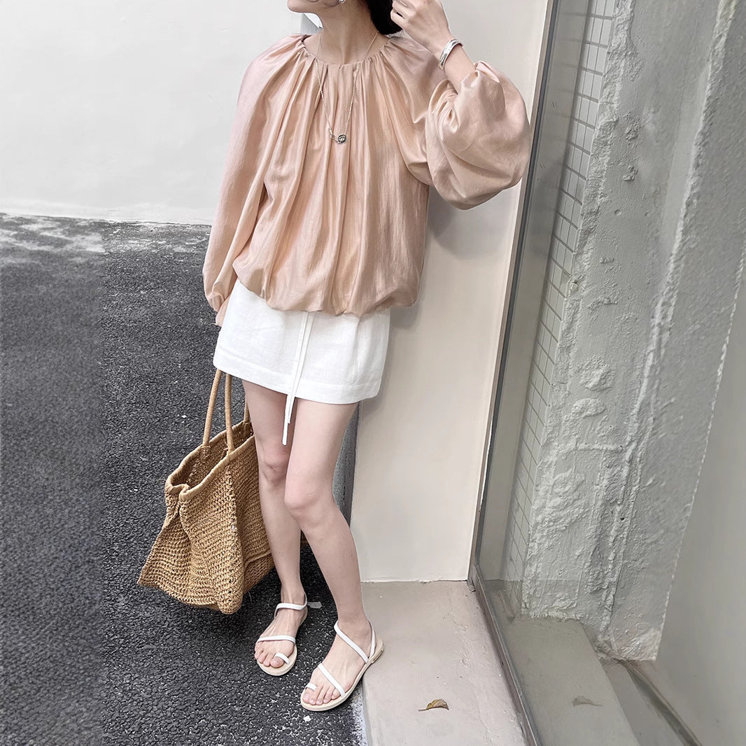 Dame elegant bluse med puffærmer og skinnende finish Stilla