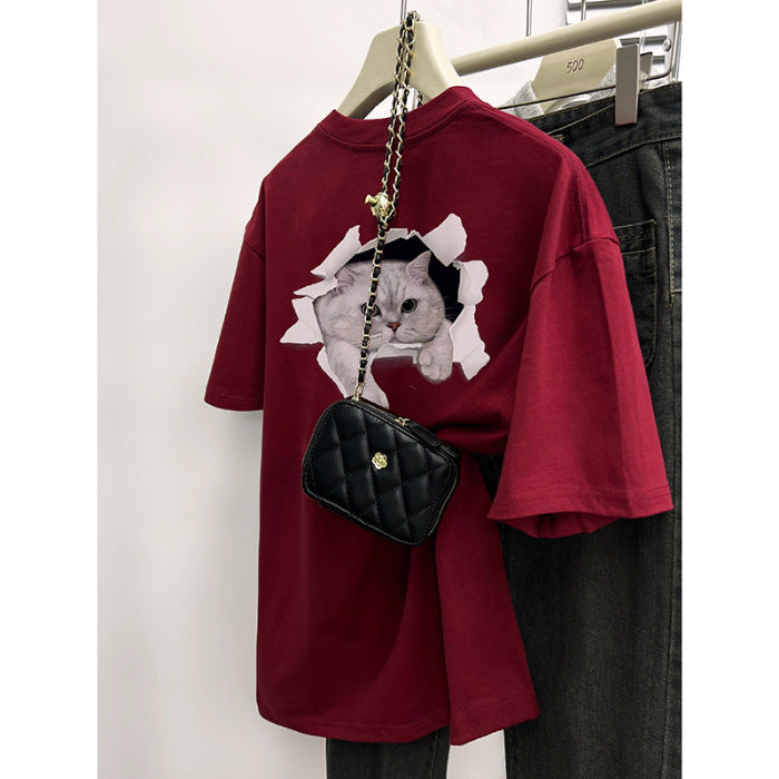 Dame T-shirt med kreativt kattemotiv gennem gennemboret væg Stilla
