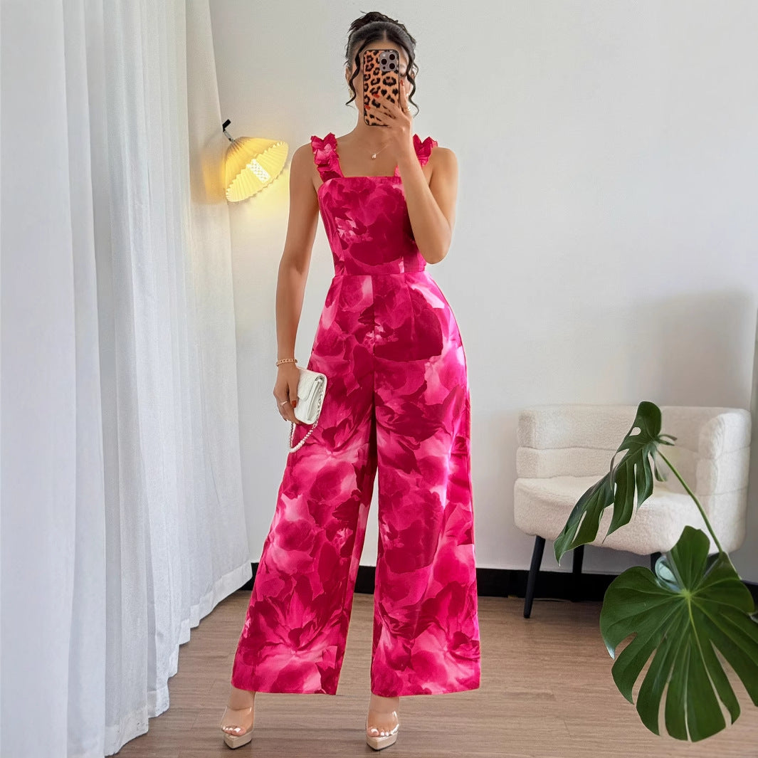 Dame jumpsuit med floral design og raffinerede flæsedetaljer Stilla