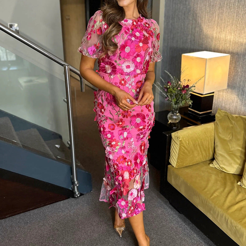 Dame Elegant blomsterkjole med transparent tyl og voluminøse pufærmer Stilla