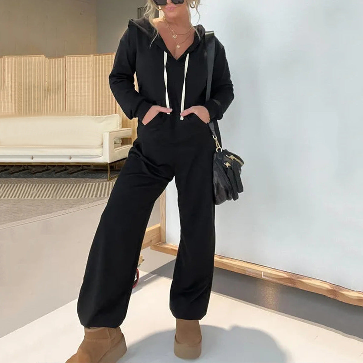 Dame hætte jumpsuit med afslappet snit og praktiske lommer Stilla