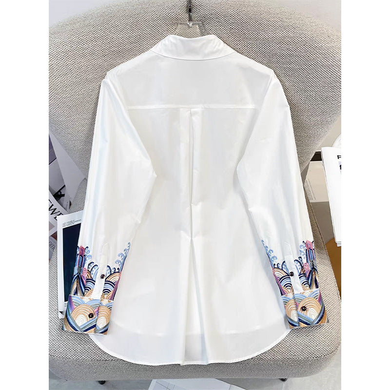 Dame eksklusiv langærmet bluse med kunstnerisk broderedesign og moderne accenter Stilla