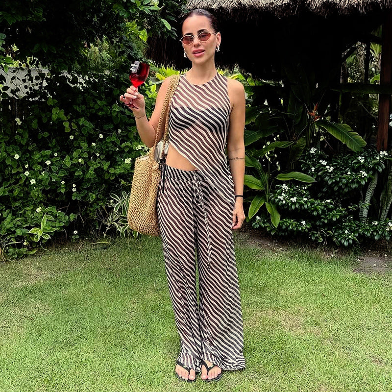 Dame stilfuld jumpsuit med asymmetrisk snit og stribemønster Stilla