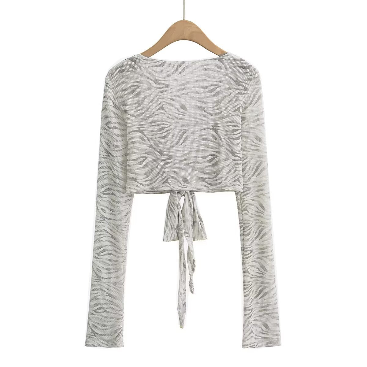 Dame cropped langærmet top med raffineret knude-design og elastisk stof Stilla