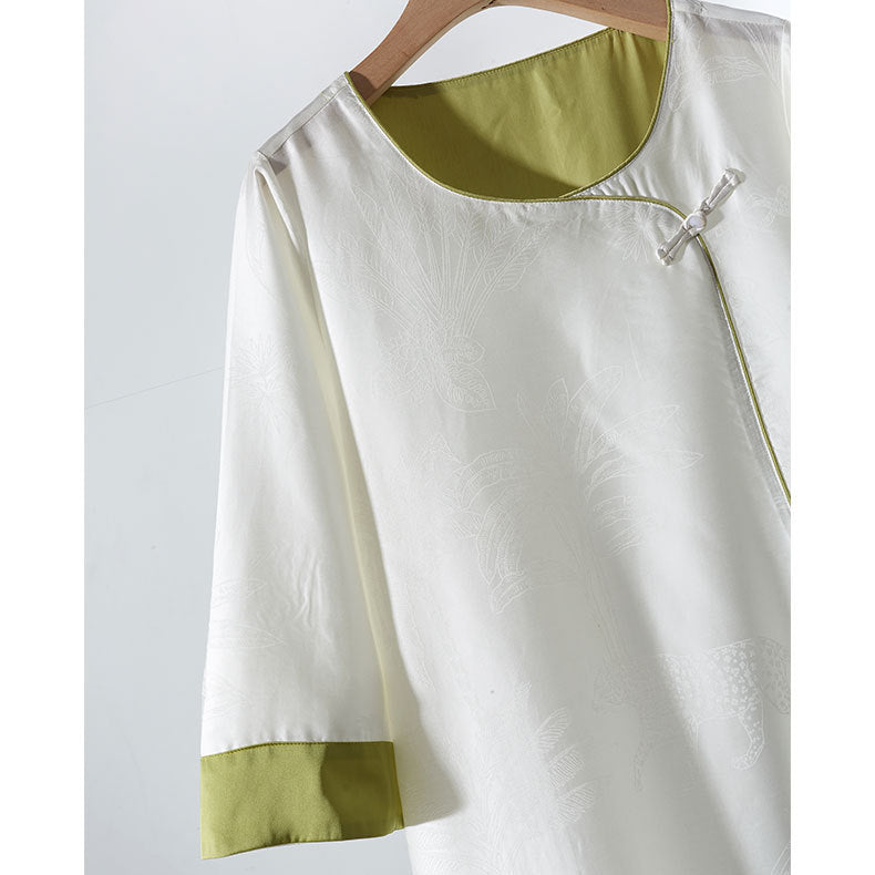 Dame bluse top med blomstret relief og elegant knaplukning Stilla