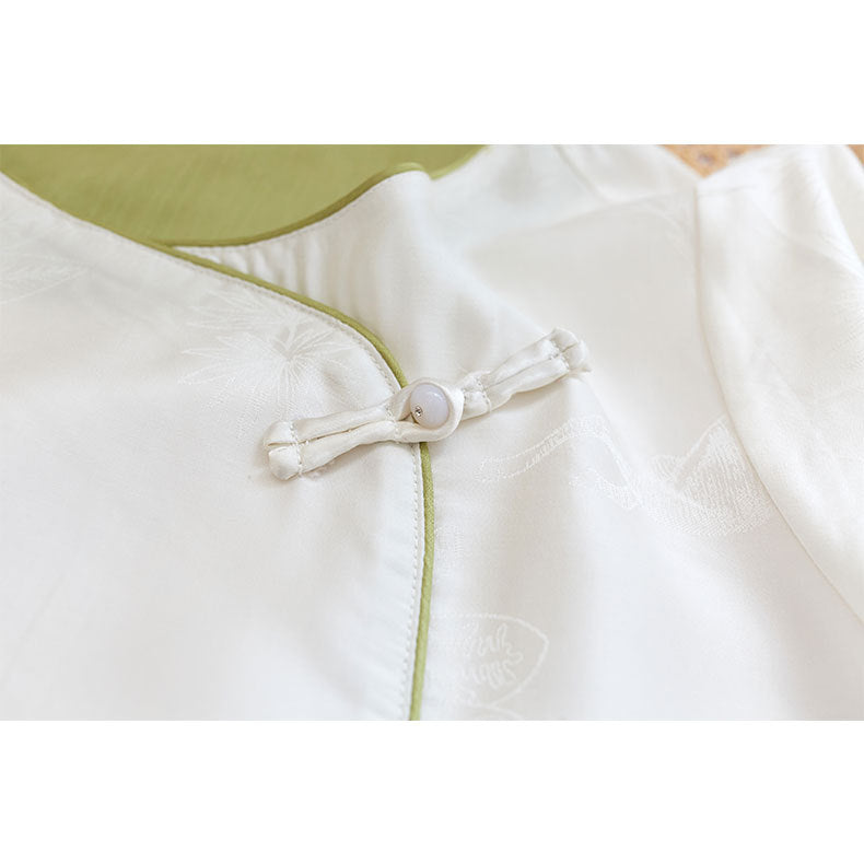 Dame bluse top med blomstret relief og elegant knaplukning Stilla