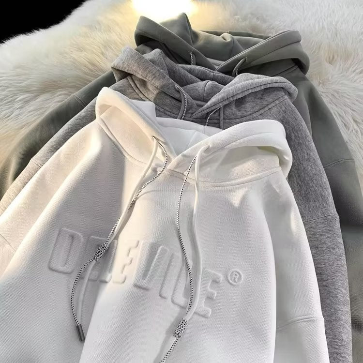 Dame Cozy Hættebluse med struktureret overflade og stilfuldt frontlogo Stilla