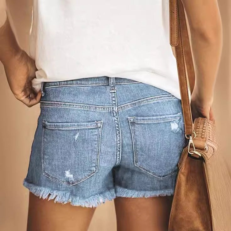 Dame Destroyed Denim-Shorts med afslappet frynseafslutning Stilla
