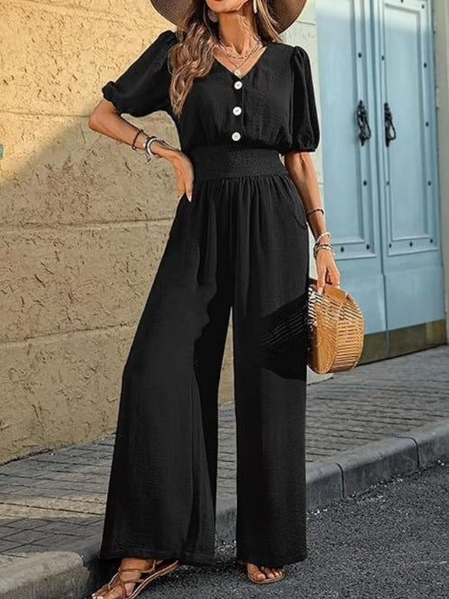 Dame jumpsuit med elastisk talje og knapdetalje Stilla