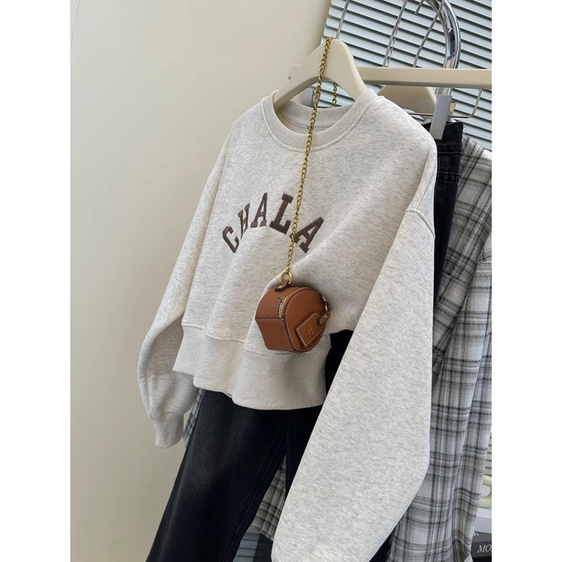 Dame Cropped Graphic Sweatshirt med distressed accenter Stilla