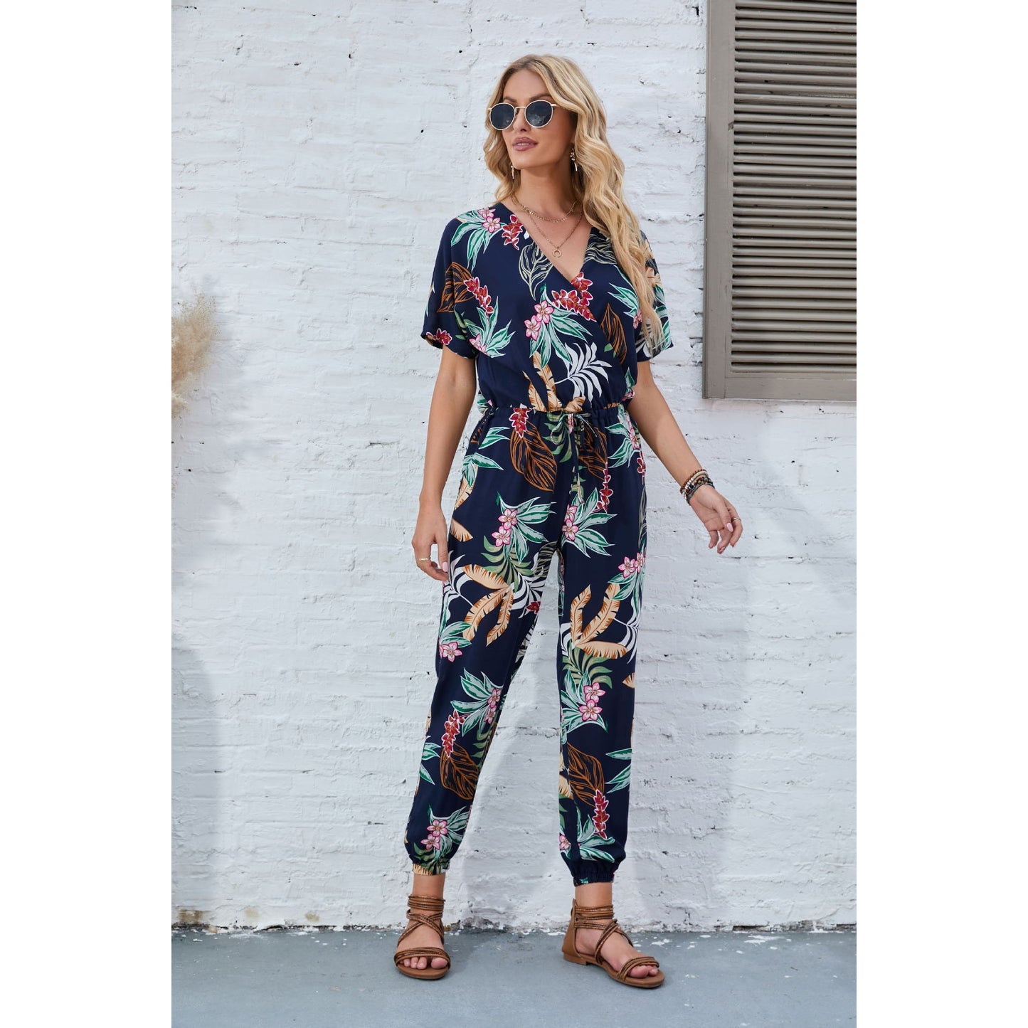 Dame afslappet jumpsuit med blomstret design og elastisk taljejustering Stilla