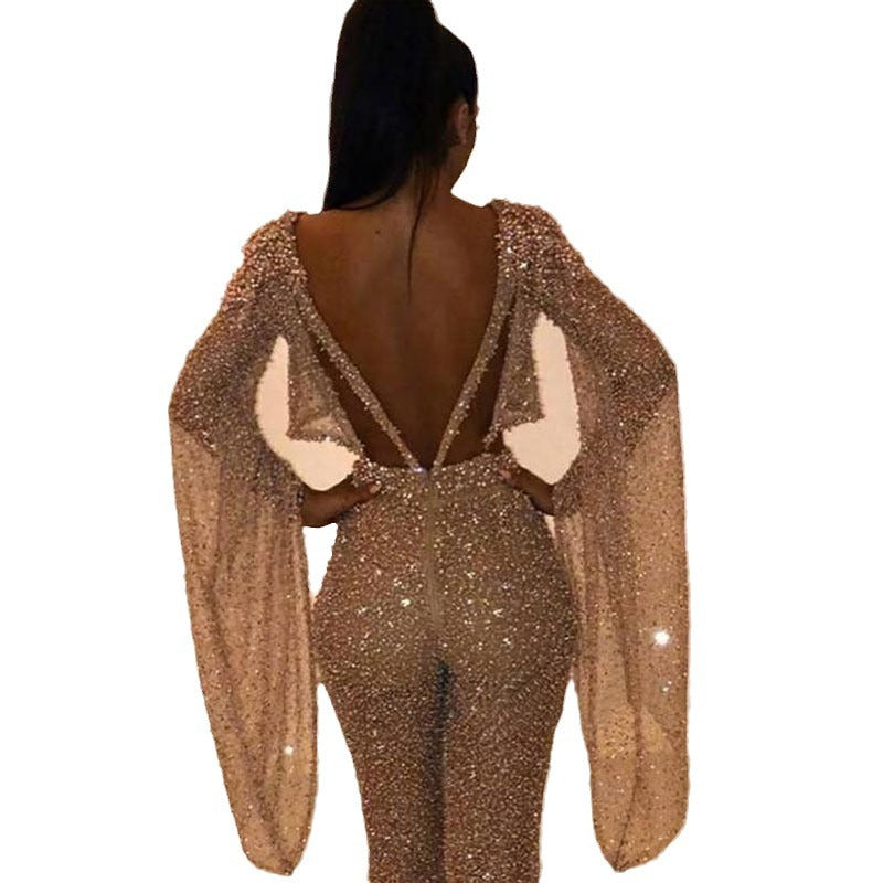 Dame Glitrende Jumpsuit med dyb ryg og flydende ærmer Stilla