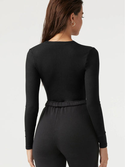 Dame bodysuit med dyb V-hals og langærmet Stilla