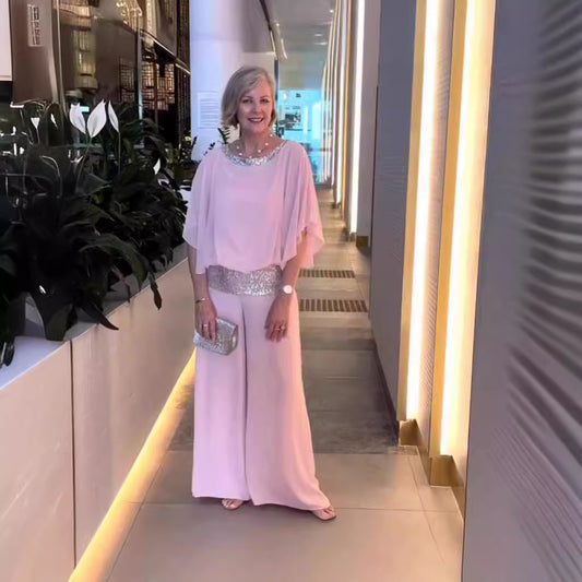 Dame elegant jumpsuit med flydende overdel og glitrende taljebånd Stiila
