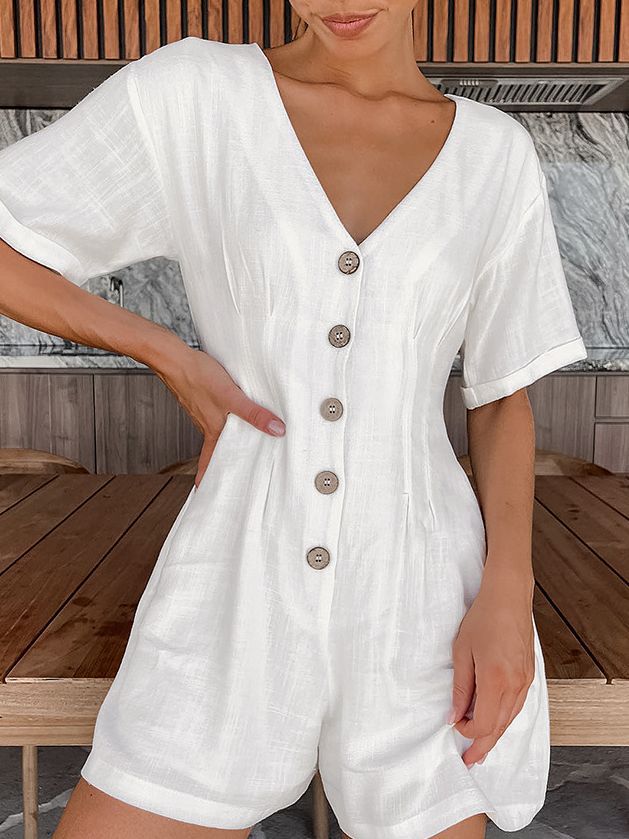 Dame jumpsuit med smart V-udskæring og knapdekoreret front Stilla