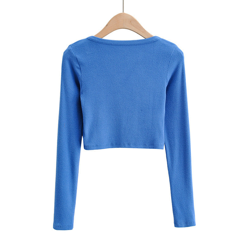 Dame cropped langærmet shirt med knapdetaljering og fin struktur Stilla