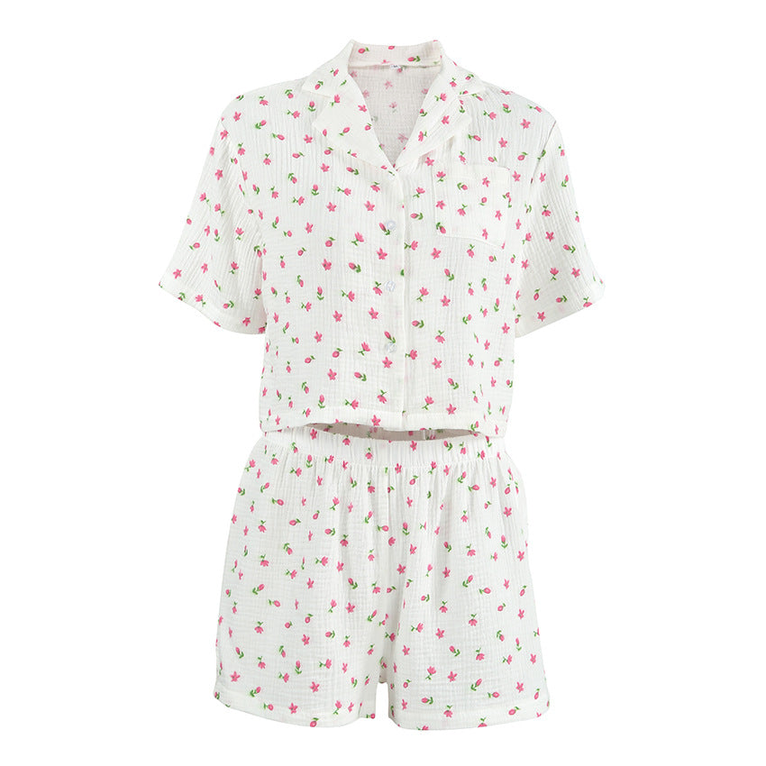 Dame afslappet pyjamasæt med blomsterprint og behagelige knapdetaljer Stilla