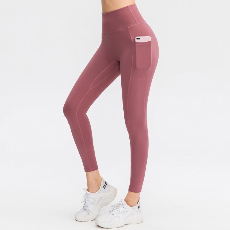 Dame højt skårne fitness leggings med praktiske sidelommer og fleksibelt materiale Stilla