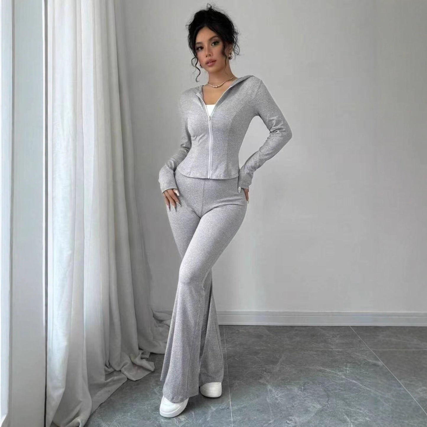 Dame Sporty Jumpsuit i elastisk materiale med lynlås Stilla