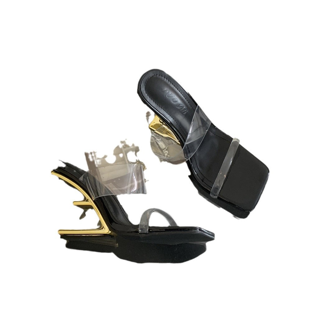 Dame åbne højhælede mules med transparent overmateriale og elegant metallisk accent Stilla