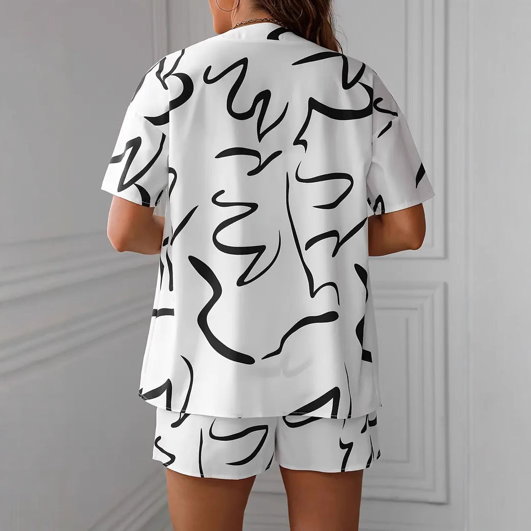 Dame Zvejedele deltid kombination med løs bluse og shorts i tropisk design Stilla