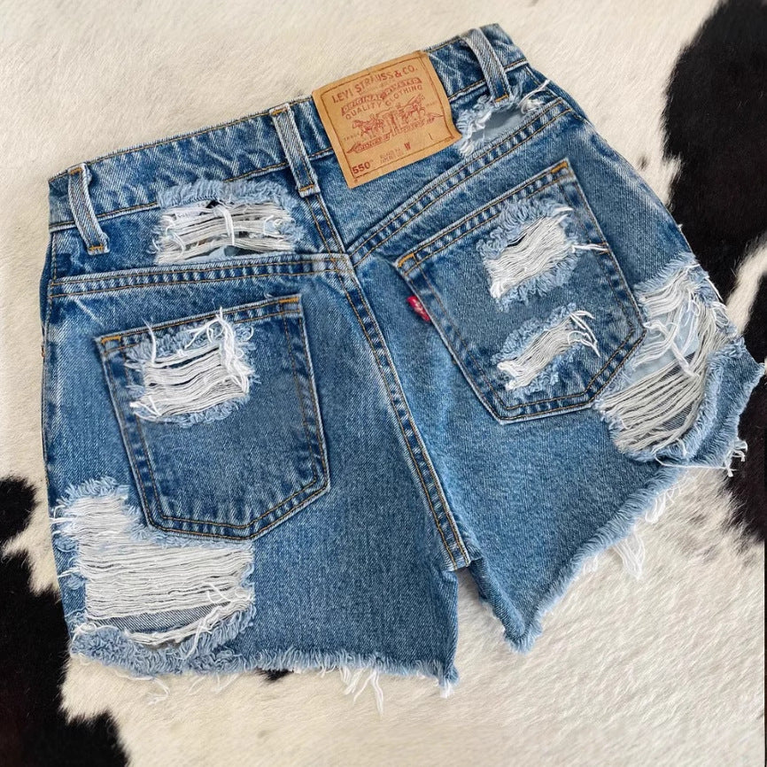 Dame Destroyed Jeansshorts i vintage stil med frynset kant og moderne ripped-detaljer Stilla