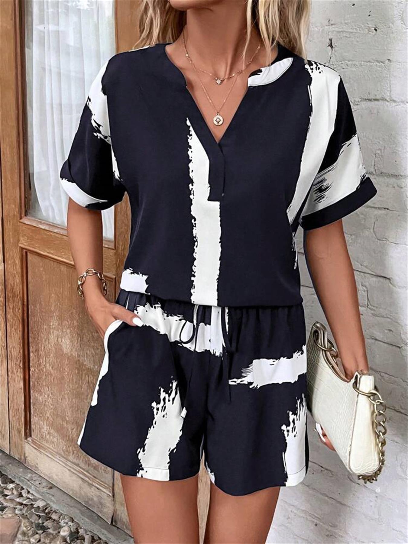 Damer kortærmet jumpsuit med moderne grafiktryk Stilla