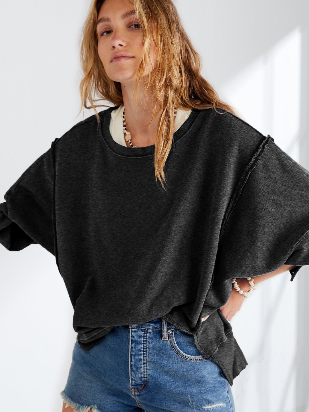 Dame afslappet oversized pullover med innovativt snit og fast stof Stilla