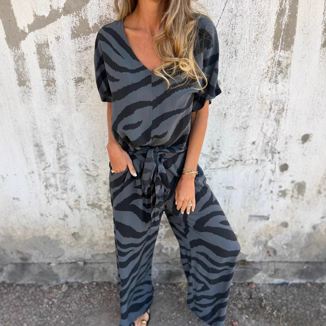 Damer stilfuld jumpsuit med vidde ben, V-halsudskæring og justerbar bånd Stilla