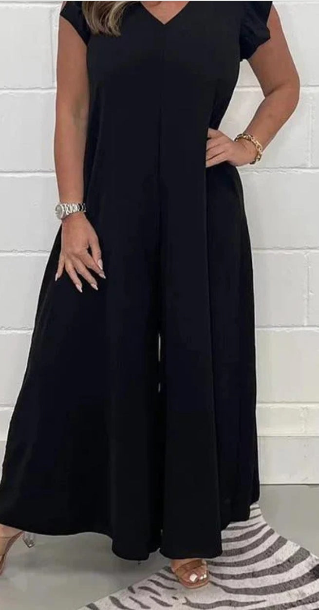Dame jumpsuit med voluminøse ben og elegant V-udskæring Stilla