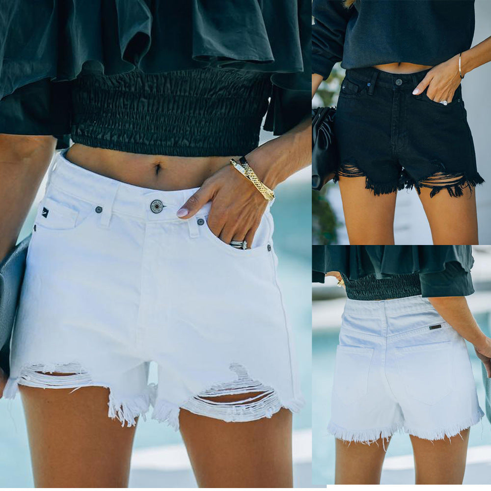 Dame denim-shorts i afslappet destroyed stil med frynset kant Stilla