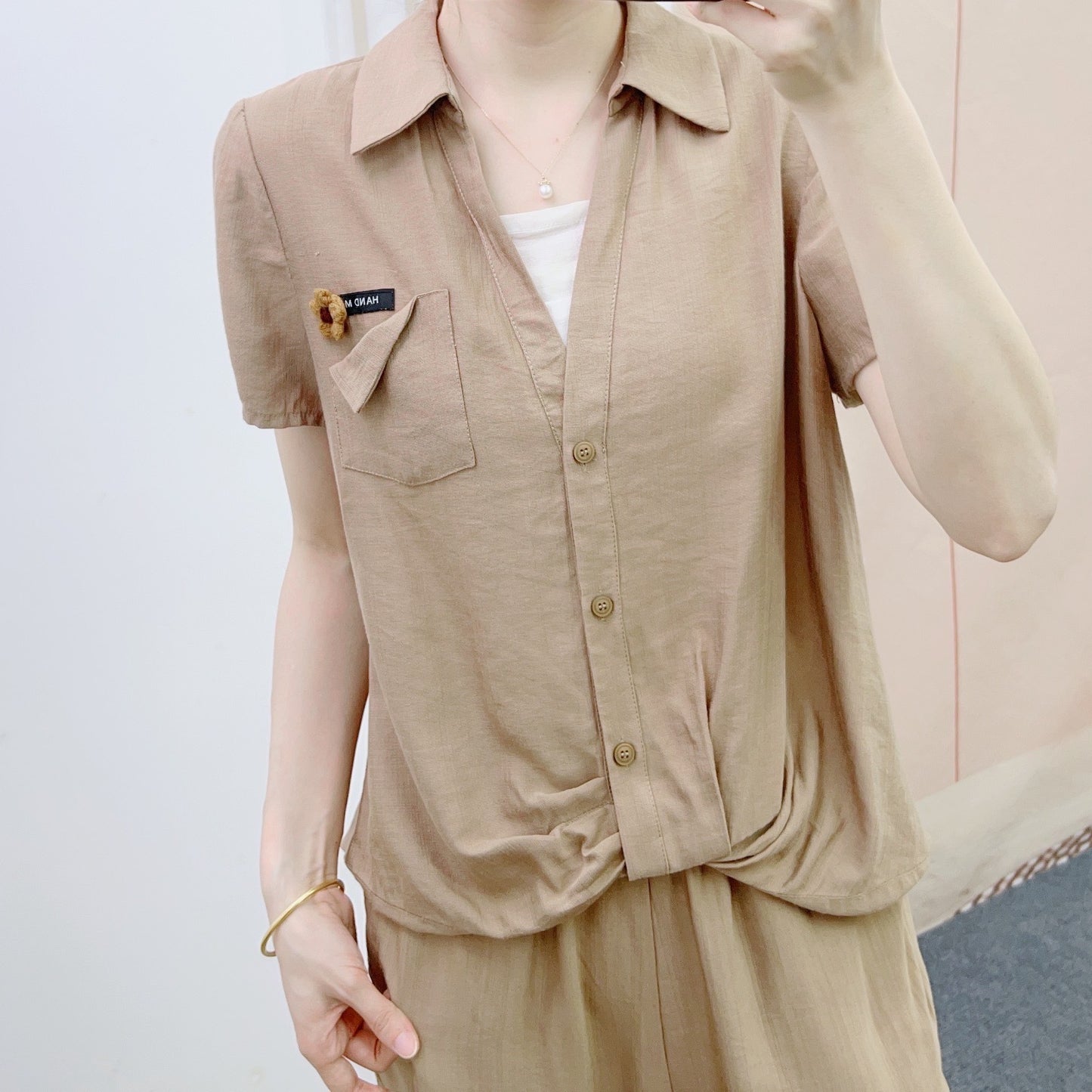 Dame afslappet jumpsuit med knapbart overdel og elegant taljebehandling Stilla