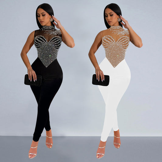 Dame glamorøs jumpsuit med glitrende strassdetaljer og gennemsigtigt overmateriale Stilla