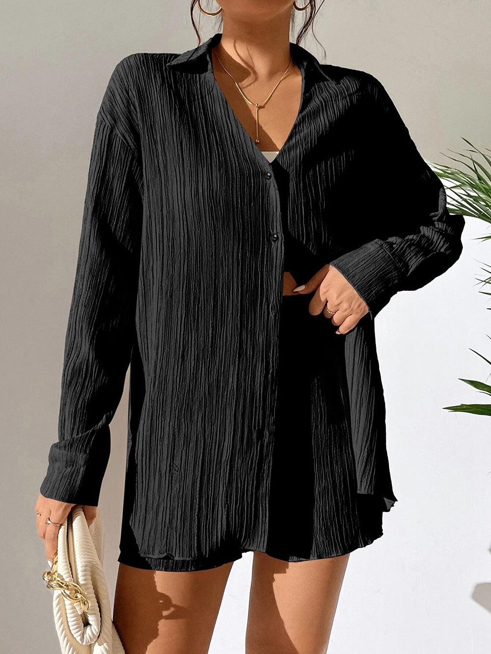 Dame afslappet kortærmet jumpsuit med struktureret overflade og elegant V-udskæring Stilla