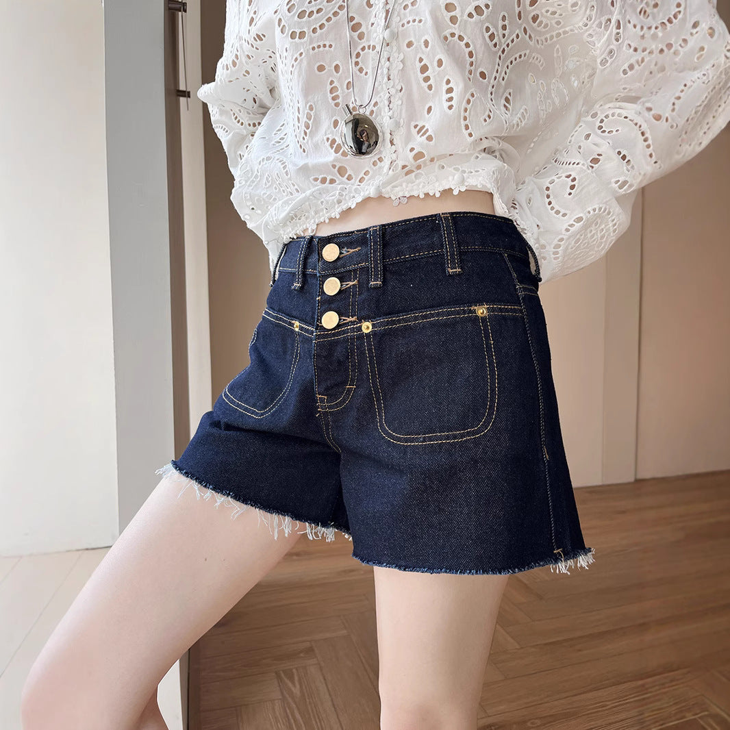 Dame Denim-shorts med knapdetalje og afslappet design Stilla