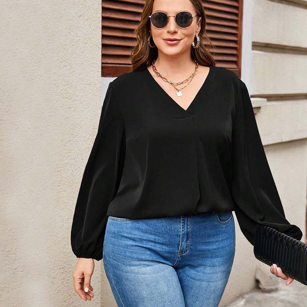 Dame afslappet bluse med stilfulde voluminøse ærmer og elegant V-hals Stilla