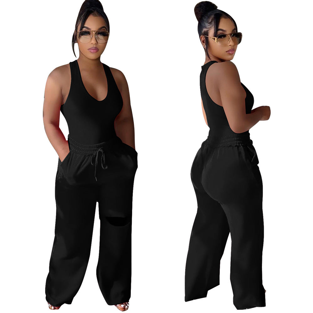 Dame sportlig jumpsuit med dyb V-udskæring og innovative lommer Stilla