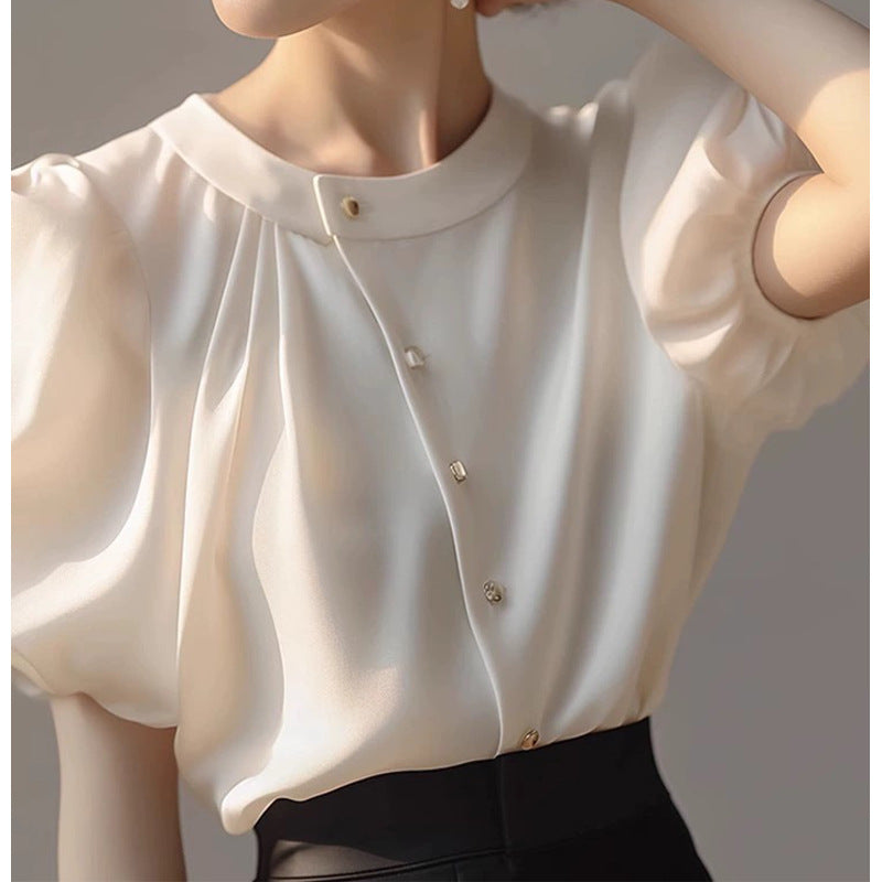 Dame elegant bluse med voluminøse ærmer og dekorative knapdetaljer Stilla