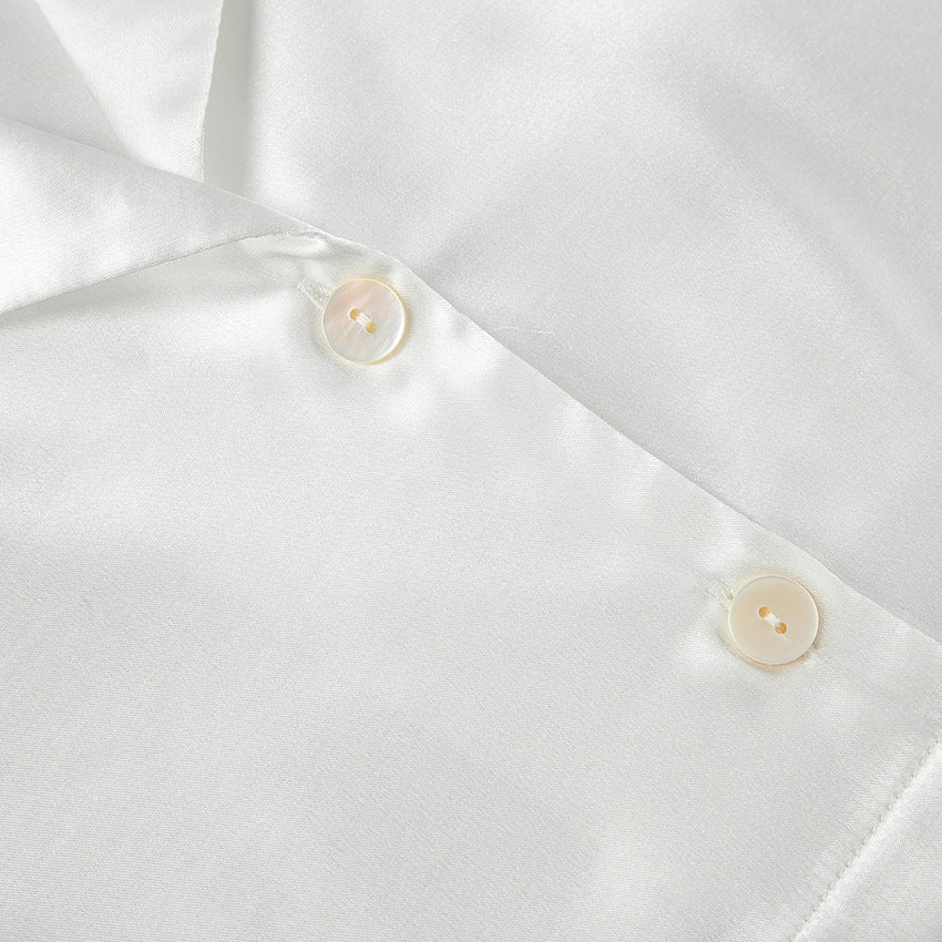 Dame Elegant cropped top og løstsiddende bukser med fjerdetaljer Stilla