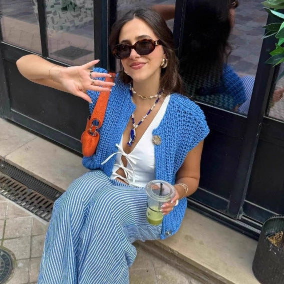 Dame strikvest med praktiske lommer og elegante knapdetaljer Stilla