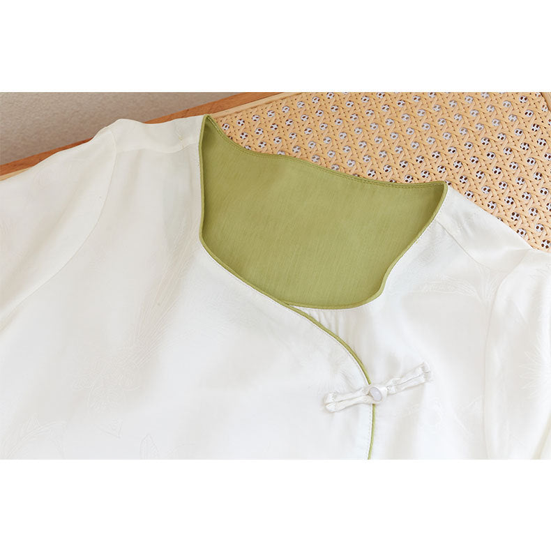 Dame bluse top med blomstret relief og elegant knaplukning Stilla