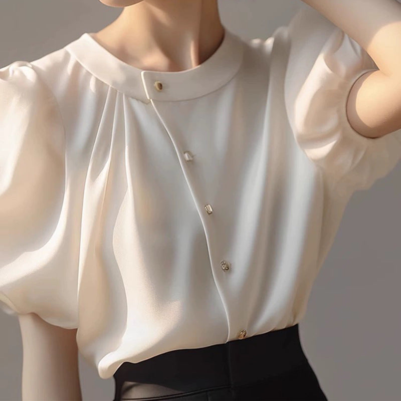 Dame elegant bluse med voluminøse ærmer og dekorative knapdetaljer Stilla