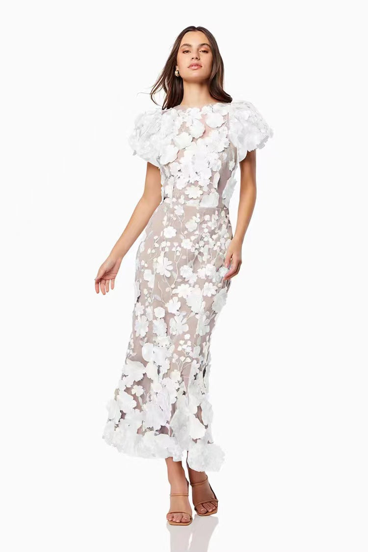 Dame Elegant blomsterkjole med transparent tyl og voluminøse pufærmer Stilla