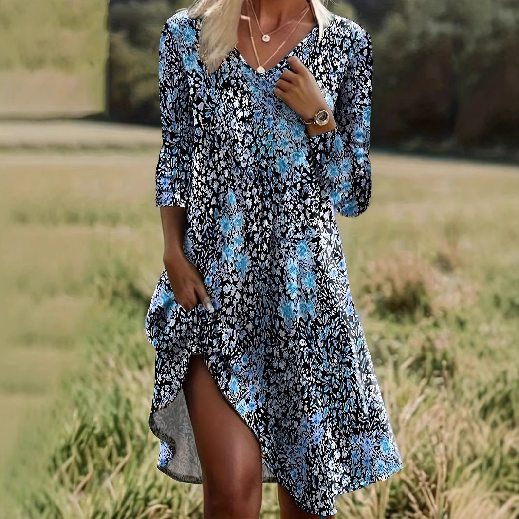 Dame afslappet midikjole med blomsterprint og asymmetrisk kant Stilla