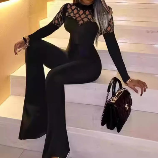Dame jumpsuit med netlignende udskæringsdesign og elegante dekordetaljer Stilla