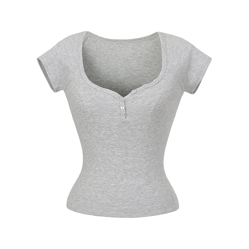 Dame figursyet top med knapbar rund halsudskæring og fin ribstruktur Stilla