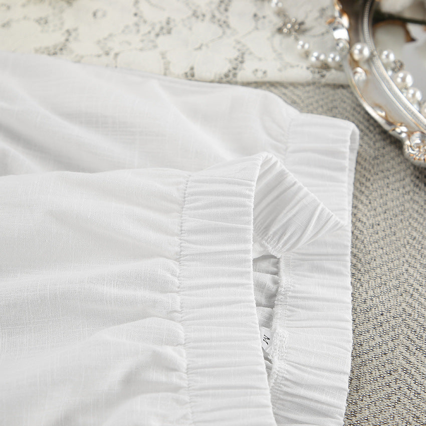 Dame afslappet bluse lavet af let hørstof med overliggende skuldre og knapdetaljer Stilla