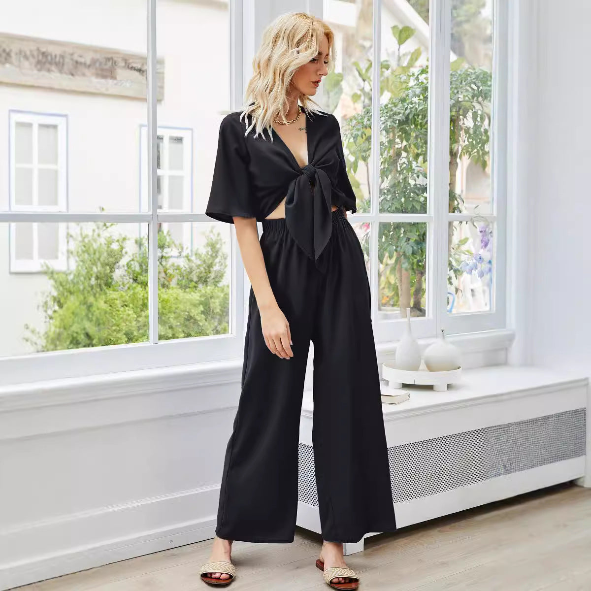 Dame stilfuld fritids-jumpsuit med dekorativt knudedesign og brede bukseben Stilla